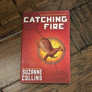 Catching Fire (Hunger Games) Scholastic Red and Gold Paperback Back Cover